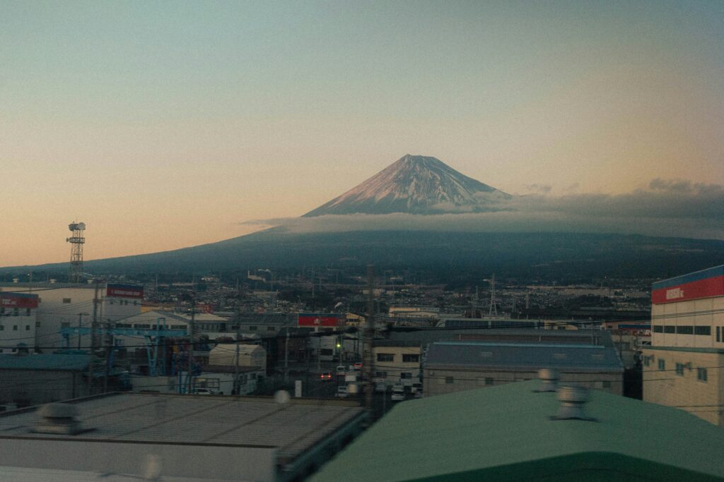 Mount Fuji at dusk viewed from a Japanese town