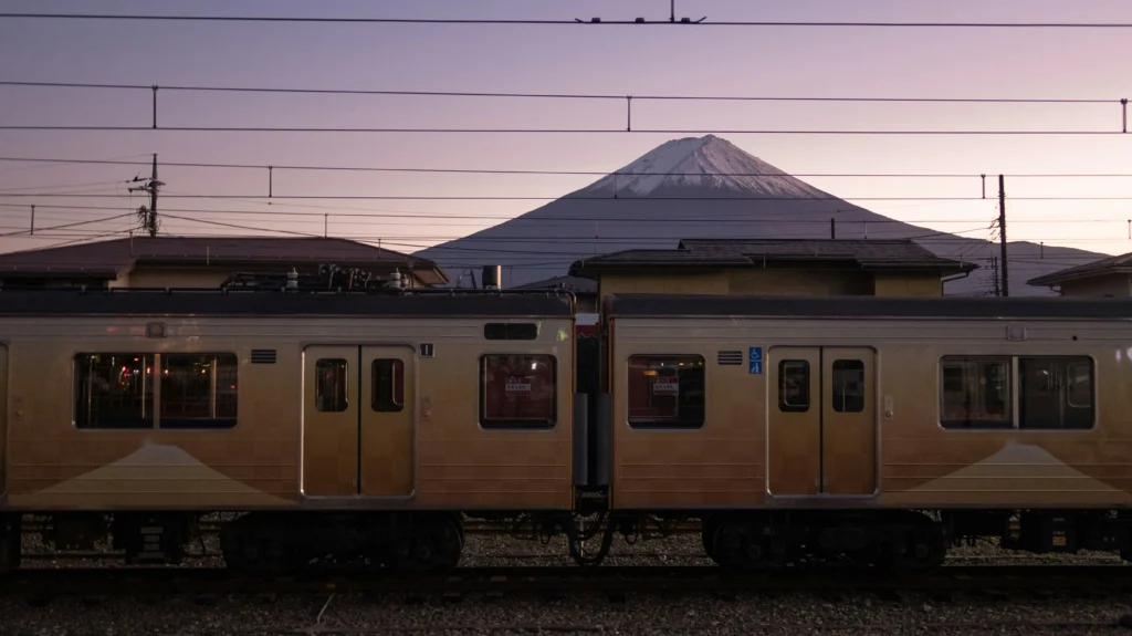 Classic rail-side view of Mt. Fuji at first light. A handy reference for visitors arriving by local train and photographers chasing golden-hour compositions around Lake Kawaguchiko.