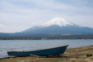 Blue boat on Lake Yamanaka with Mount Fuji in the background