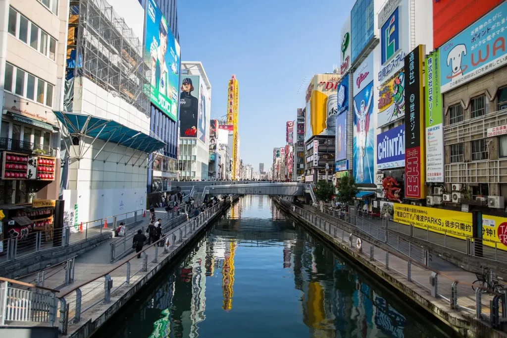 Dotonbori canal in Osaka with colorful signs and reflections