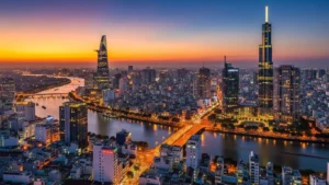 Capture the vibrant sunset skyline of Ho Chi Minh City, featuring Bitexco Tower, Landmark 81, and the glowing Saigon River—perfect for Vietnam travel inspiration.